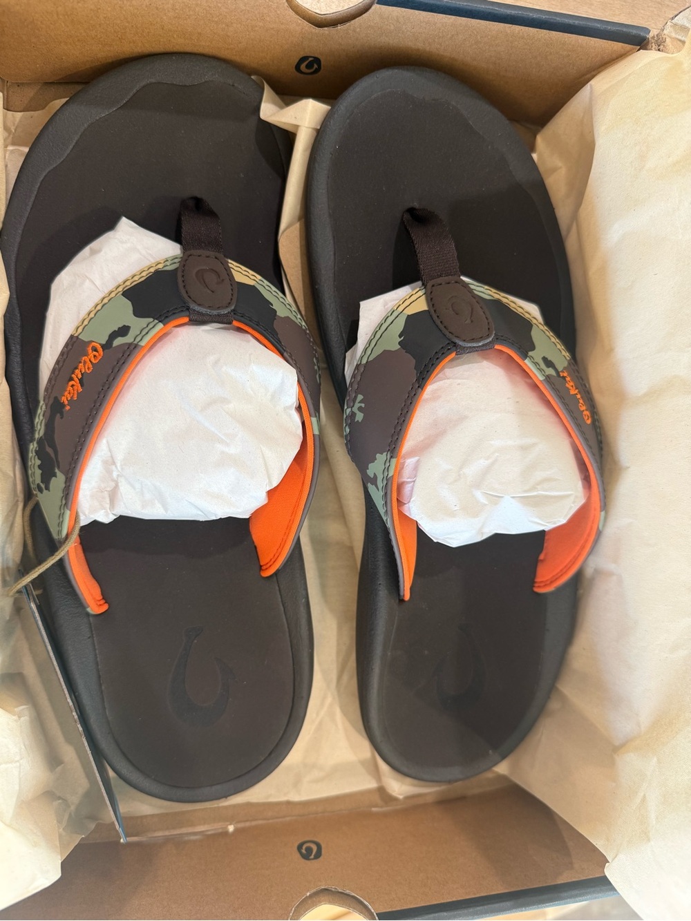 OluKai Men's Black Flip-Flops with Camo Straps and Orange Trim